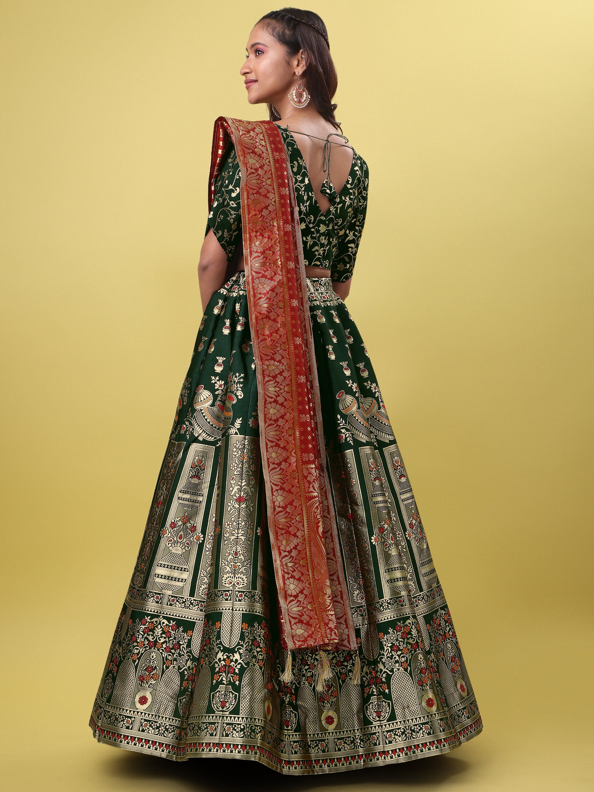 Decorated With Beautiful Flower Motif Dark Green Lehenga Choli